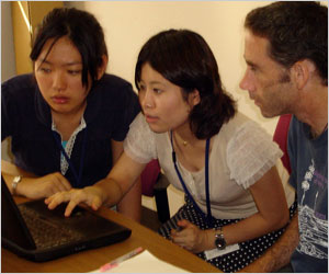 the students and Austen Ganley (Assist. Prof., right) are discussing the data.